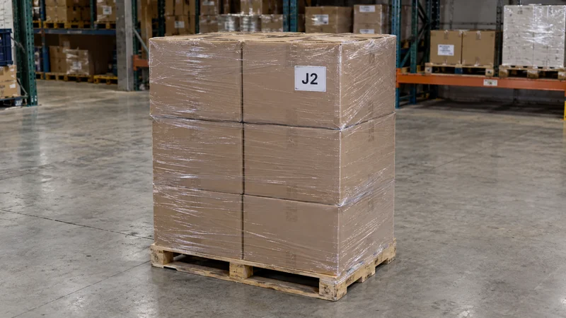 Keep a selected stock unit distinct from goods that stay A wrapped selected-stock pallet has a visible dispatch identifier in a clear industrial bay