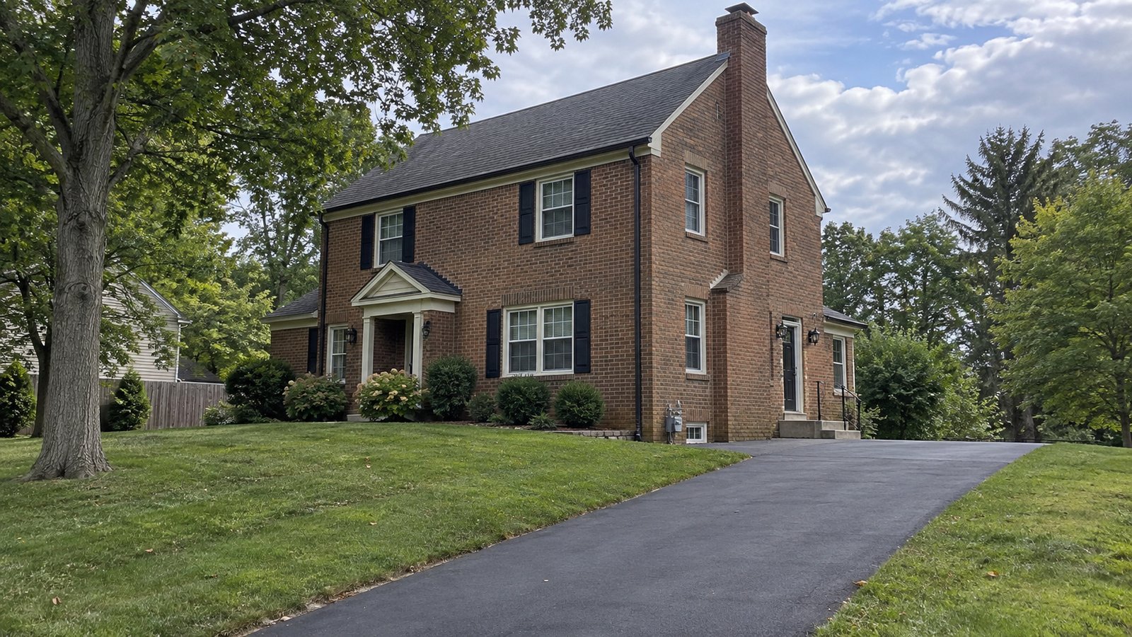 Check every part of the approach A complete two-story brick house with a paved side approach, entrance landing, concrete step and anchored handrail.