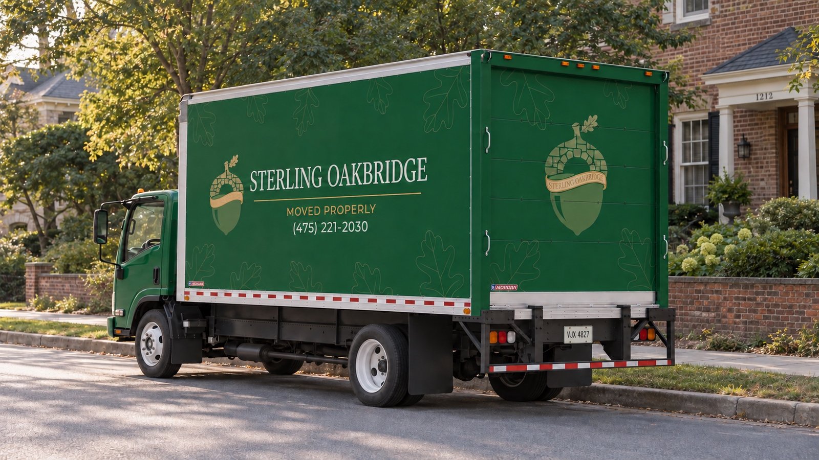 Green Sterling Oakbridge NPR truck parked parallel beside a residential sidewalk