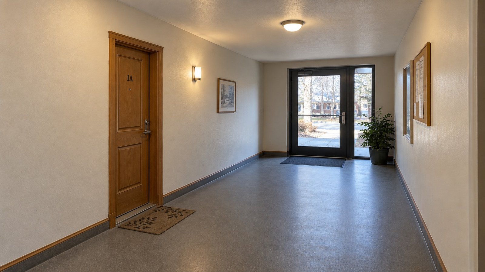 Follow the shared interior route An interior apartment corridor with a whole wooden apartment door and a glazed shared entrance with a fixed sidelight.