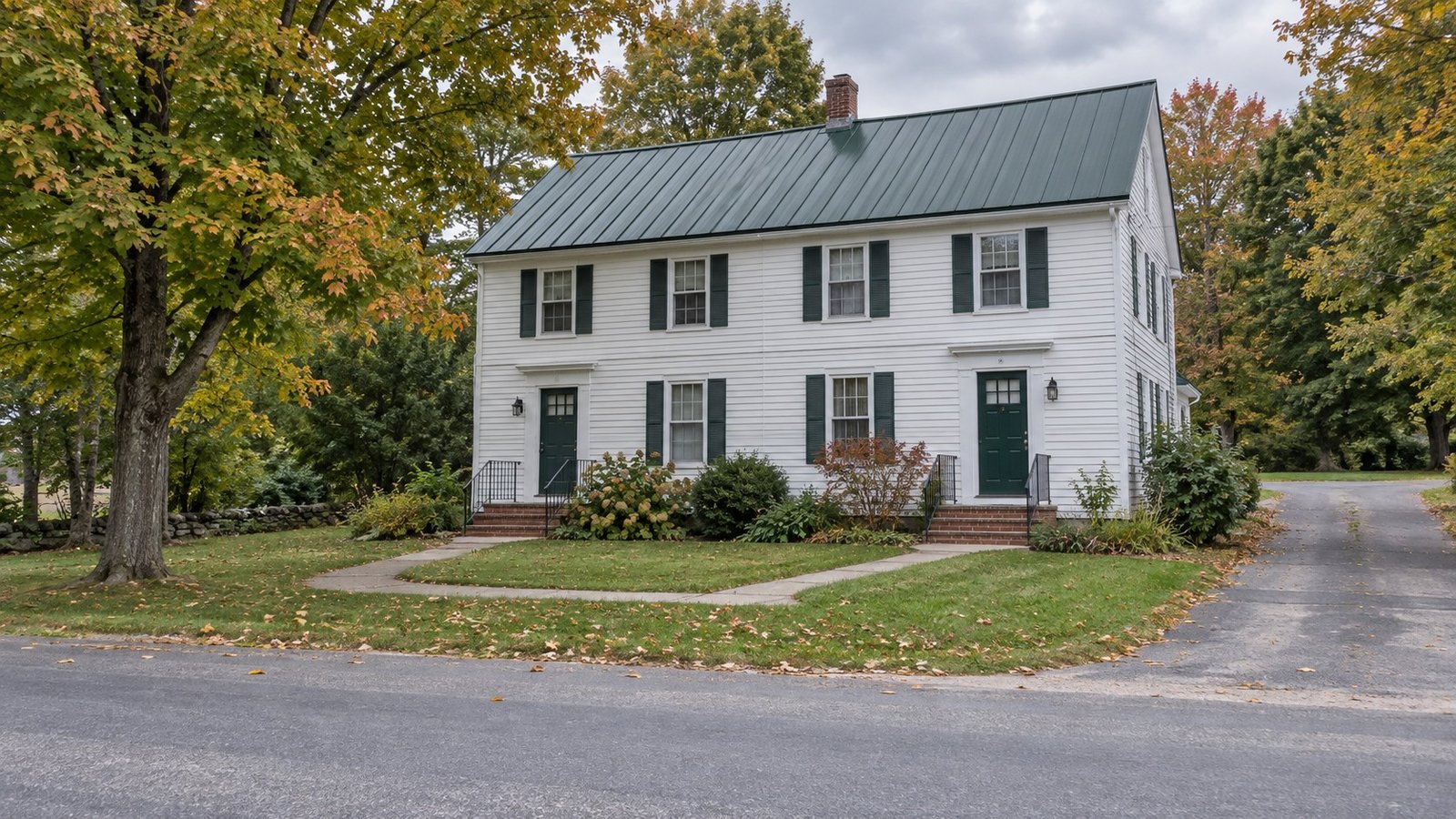 See the actual entries A complete modest white clapboard duplex with two separate front doors and connected walks.