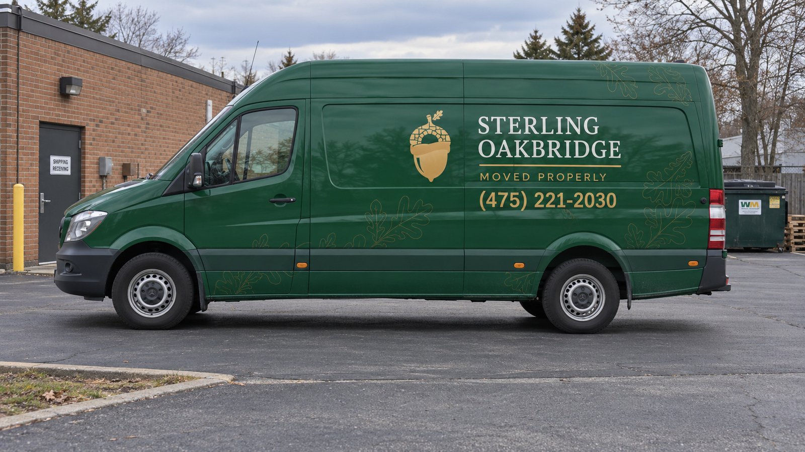 Agree the vehicle standing place Green Sterling Oakbridge Mercedes Sprinter van parked beside a low brick building