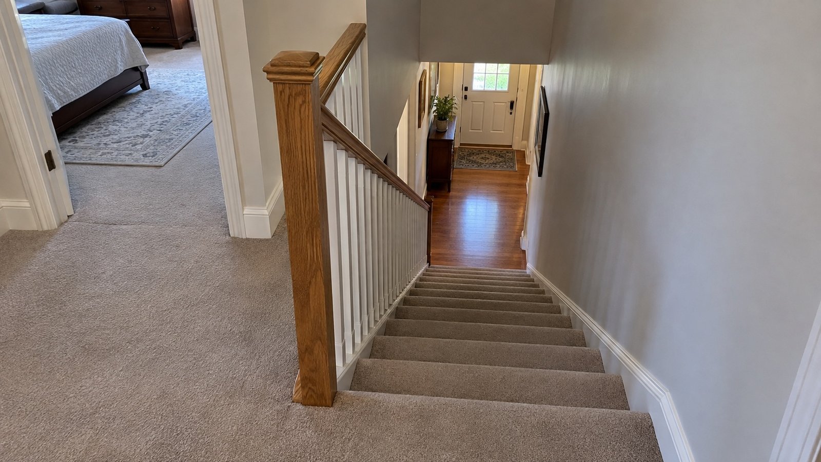 Complete townhouse stair and both landings viewed diagonally from the upper floor Complete townhouse stair and both landings viewed diagonally from the upper floor