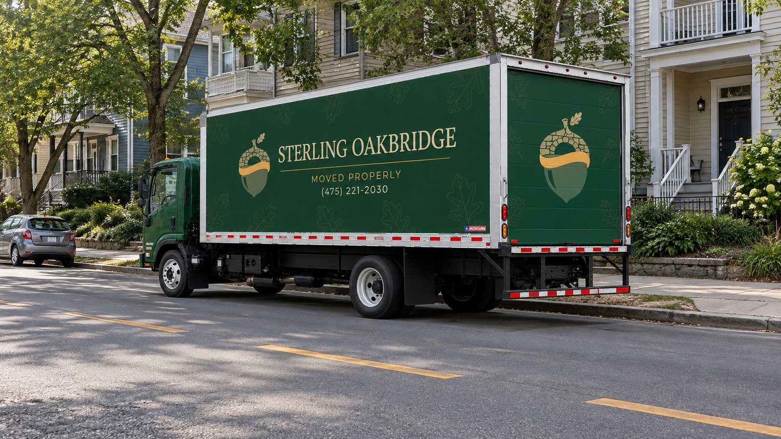 Truck footprint and separate sidewalk Green Isuzu FTR moving truck beside a residential curb with roadway passage and separate sidewalk