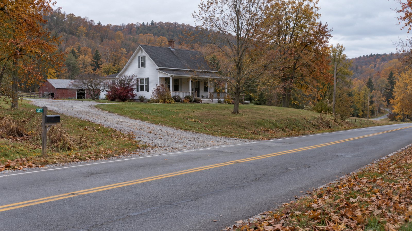 Prepare for the season A complete white farmhouse and gravel driveway beside a straight rural road and autumn hills.