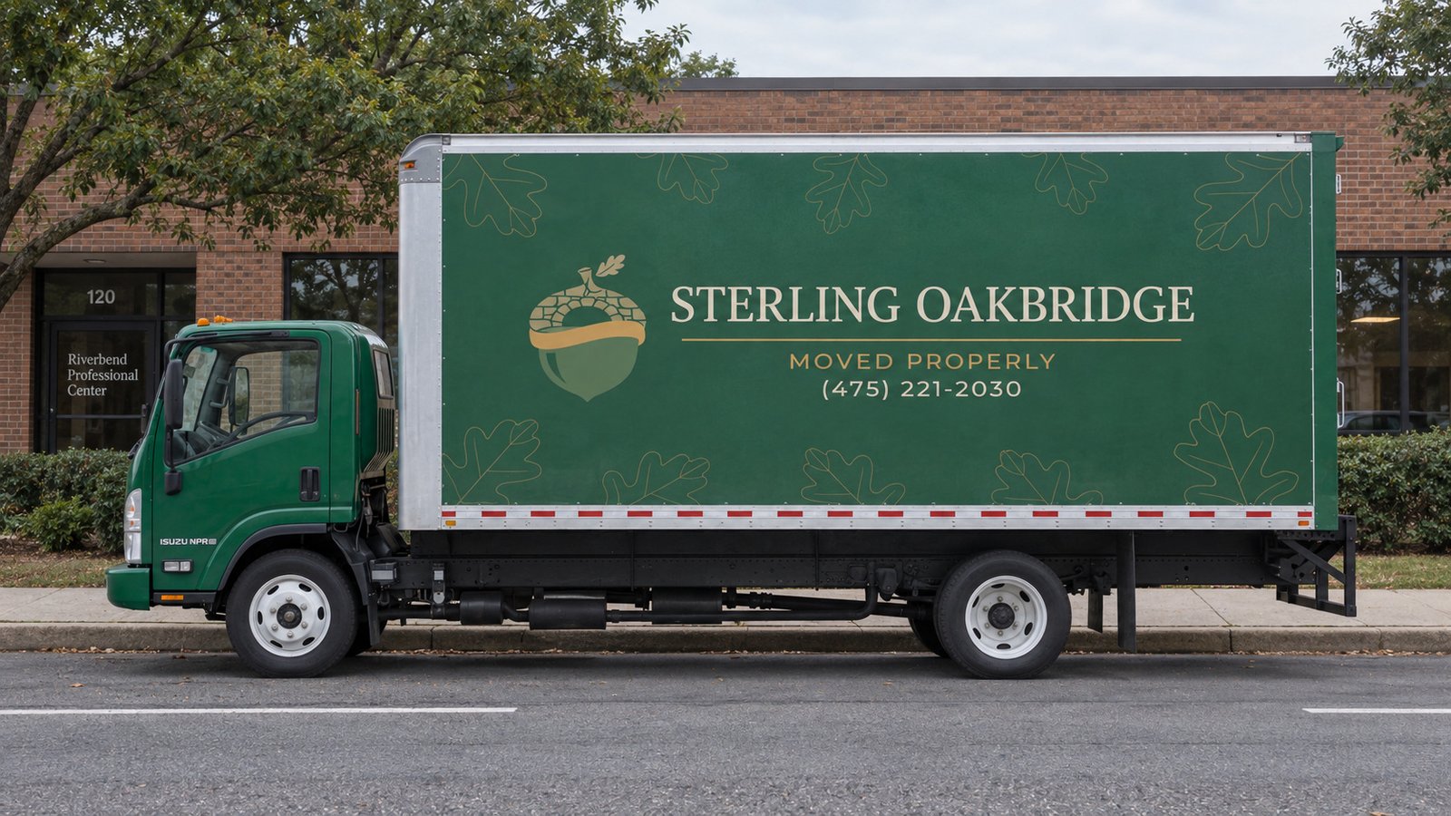 Review the proposed vehicle position A complete green Sterling Oakbridge Isuzu NPR box truck parallel to a straight curb on an asphalt roadway.