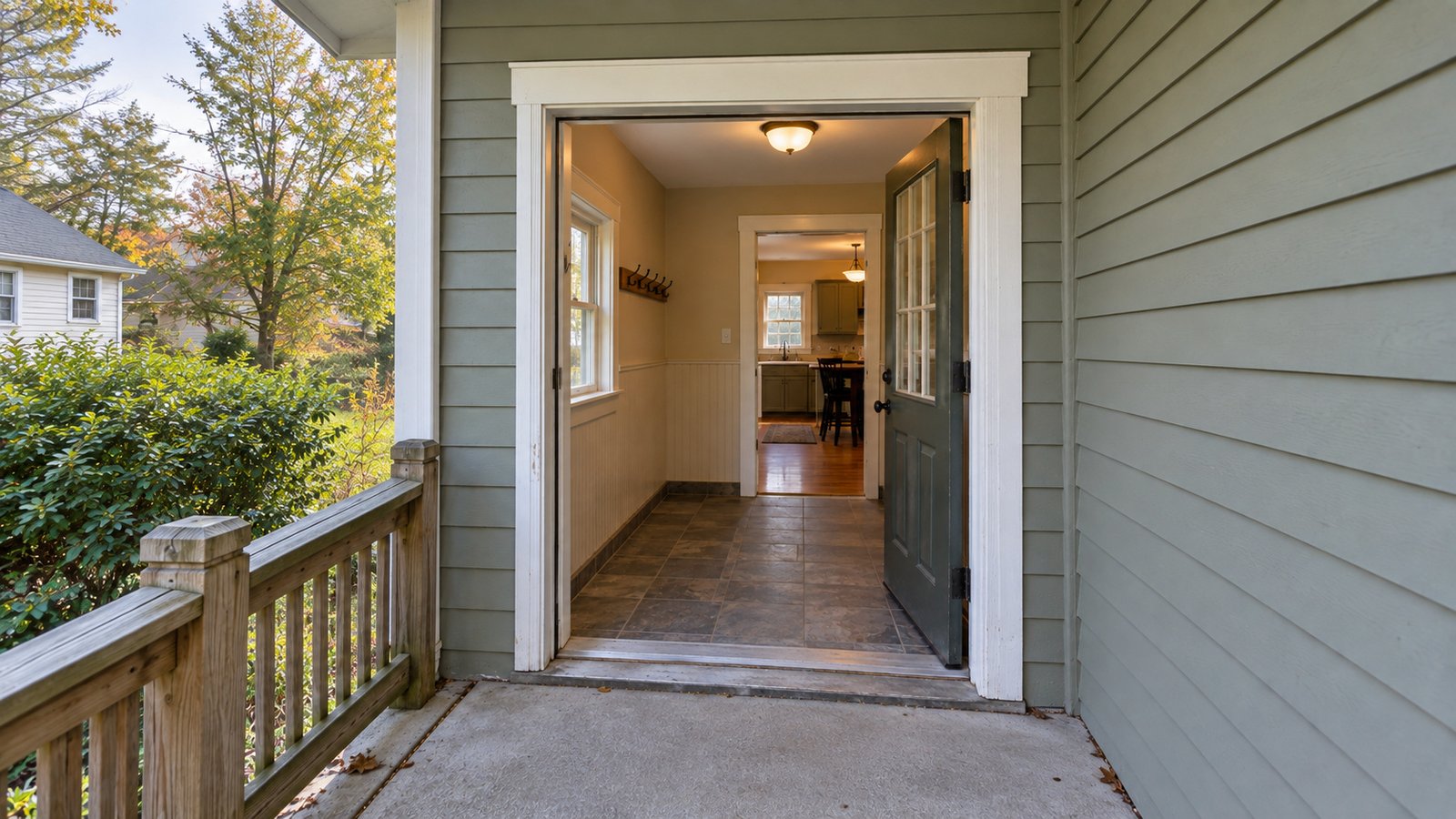 Two doorways on the delivery route Open back door leading through a clear tiled mudroom to a second doorway into the house