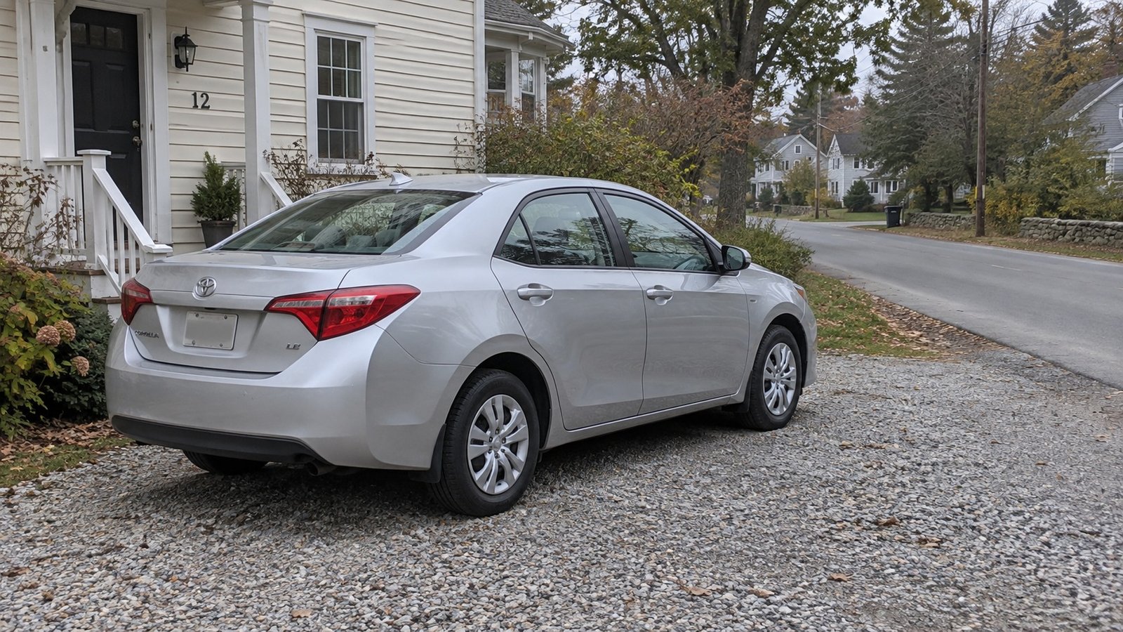 Try the complete daily journey A complete ordinary car standing on a private home drive.