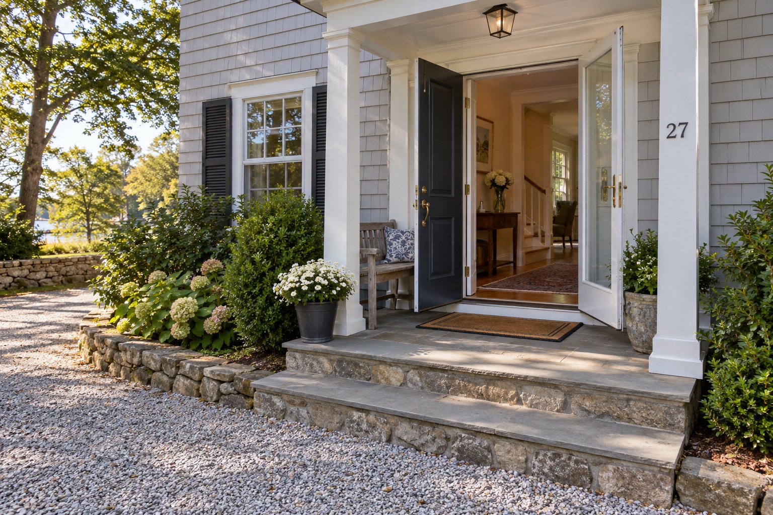 Inspect the entrance and steps An open Cape porch doorway with matching single entry and storm leaves, two stone steps and a furnished hall beyond.